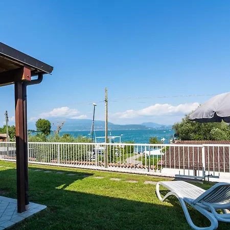 On Lake Garda With Pebble Beach Pier For Boat Three Swimming Pools