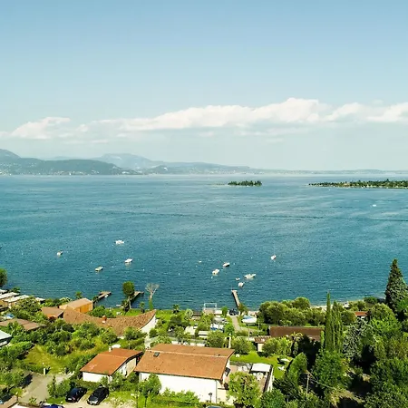 On Lake Garda With Pebble Beach Pier For Boat Three Swimming Pools