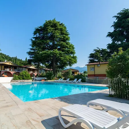 On Lake Garda With Pebble Beach Pier For Boat Three Swimming Pools *